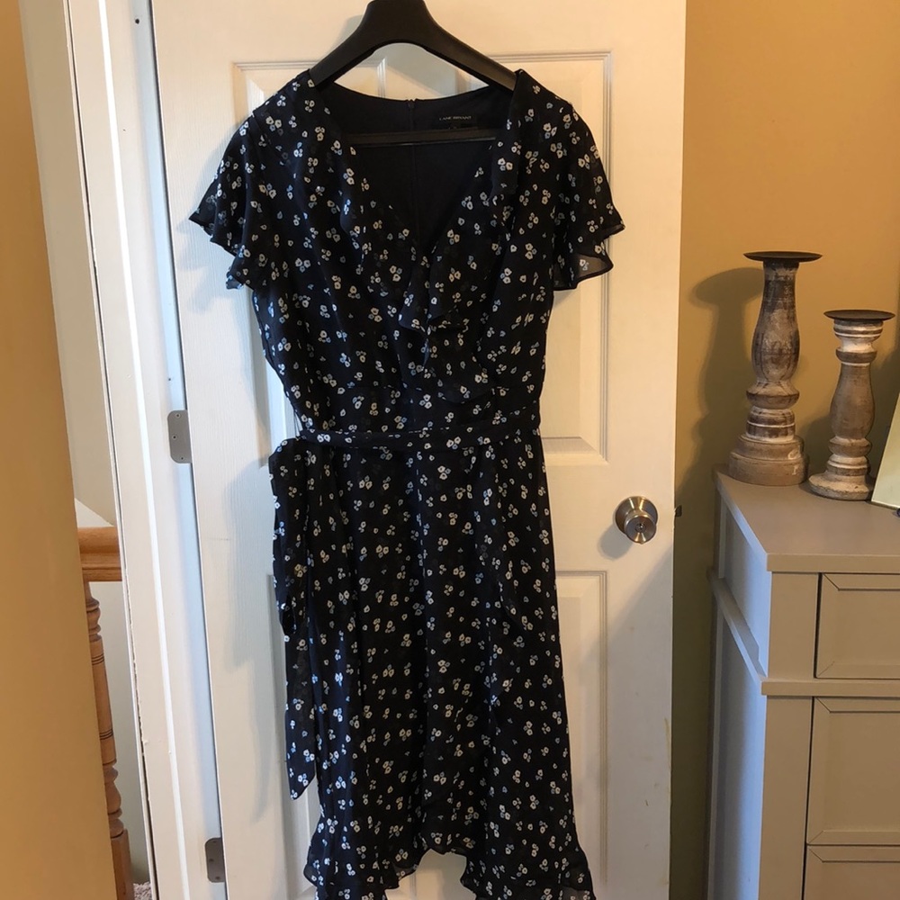 Navy blue and floral print “wrap” dress